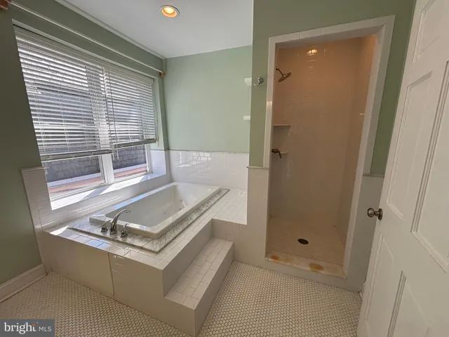 a living room with a window and a table