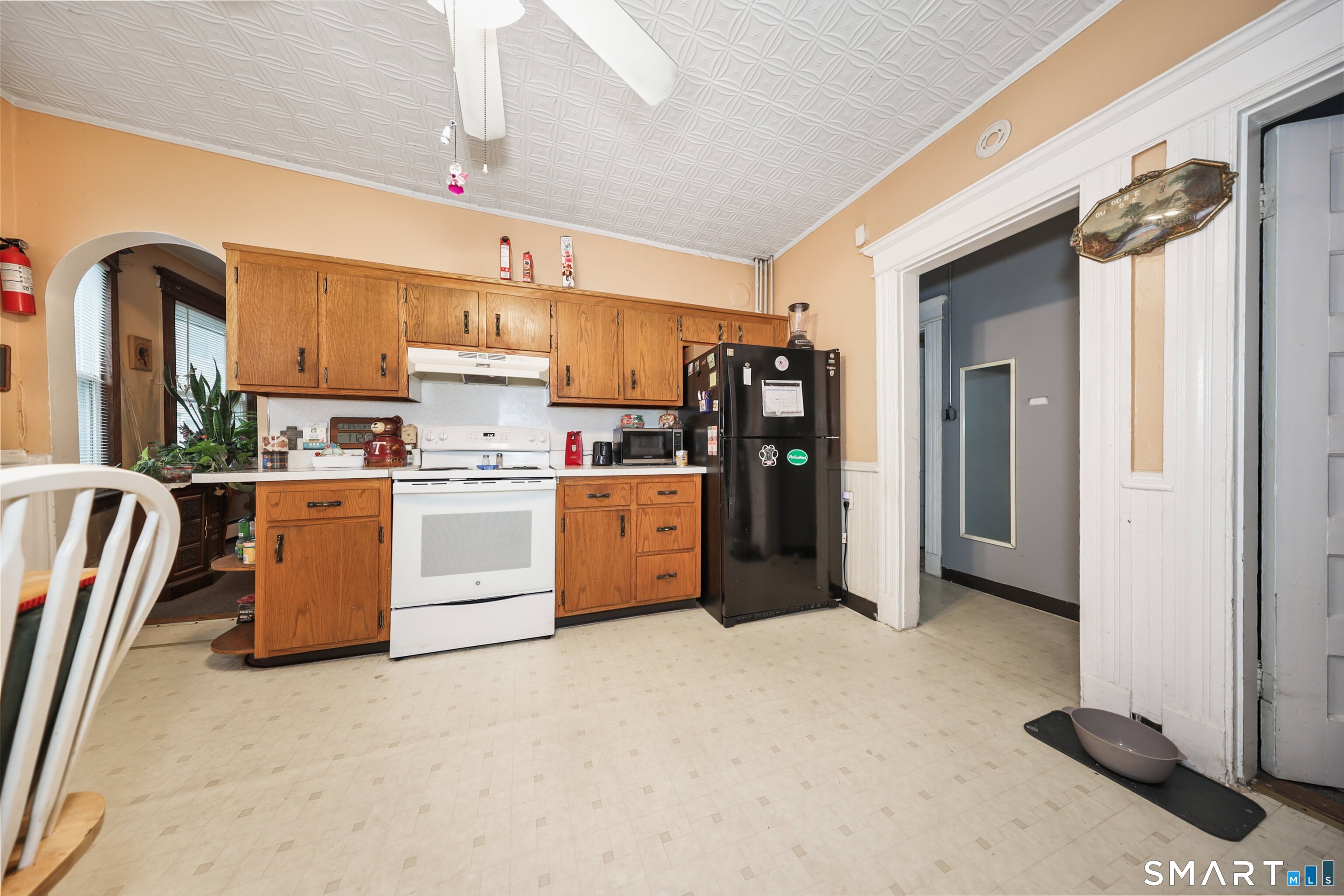 82 Bunker Hill Avenue Waterbury, CT 06708 - Photo 11 of 37 a kitchen with stainless steel appliances a refrigerator and a stove