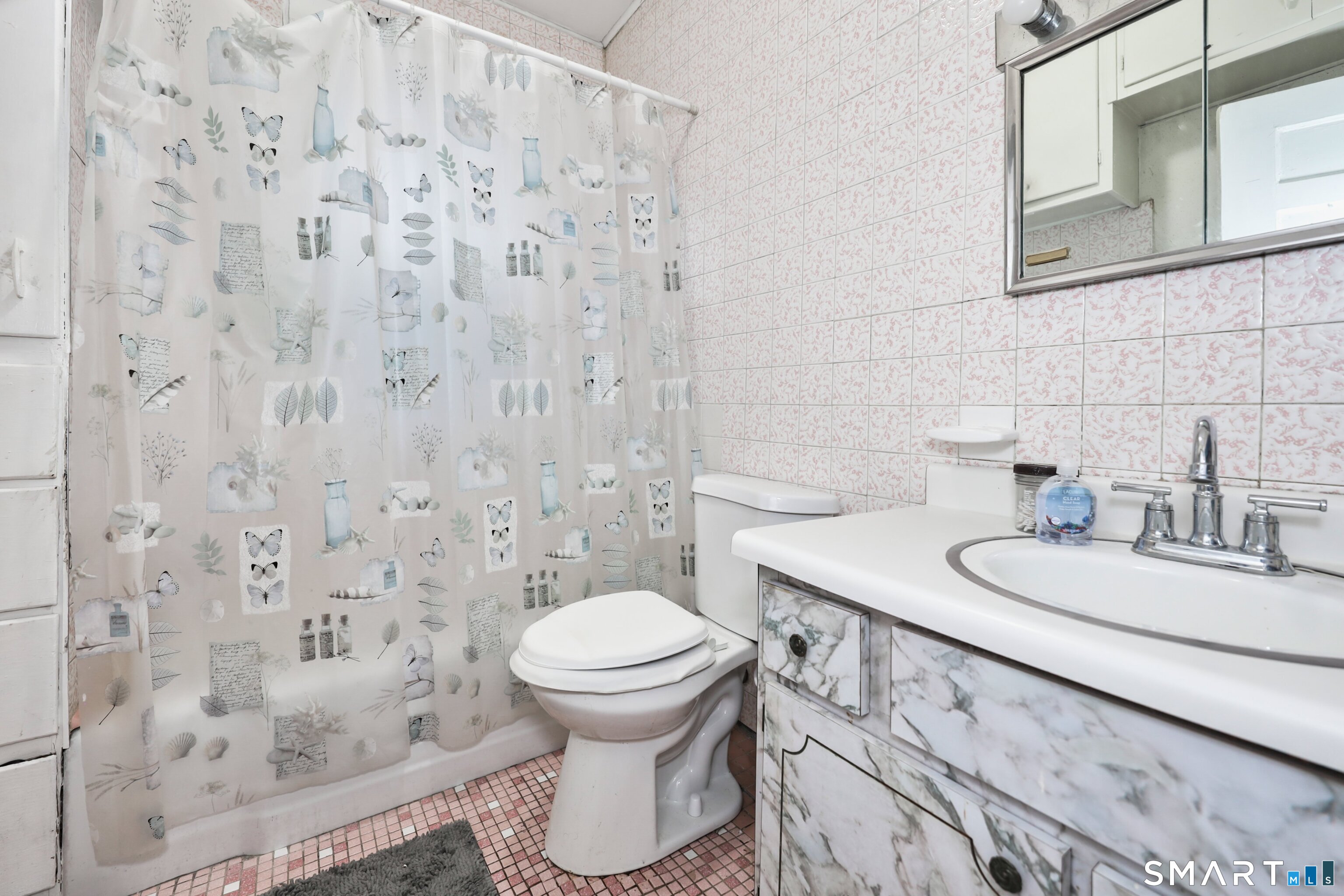 82 Bunker Hill Avenue Waterbury, CT 06708 - Photo 13 of 37 a bathroom with a sink toilet and a mirror