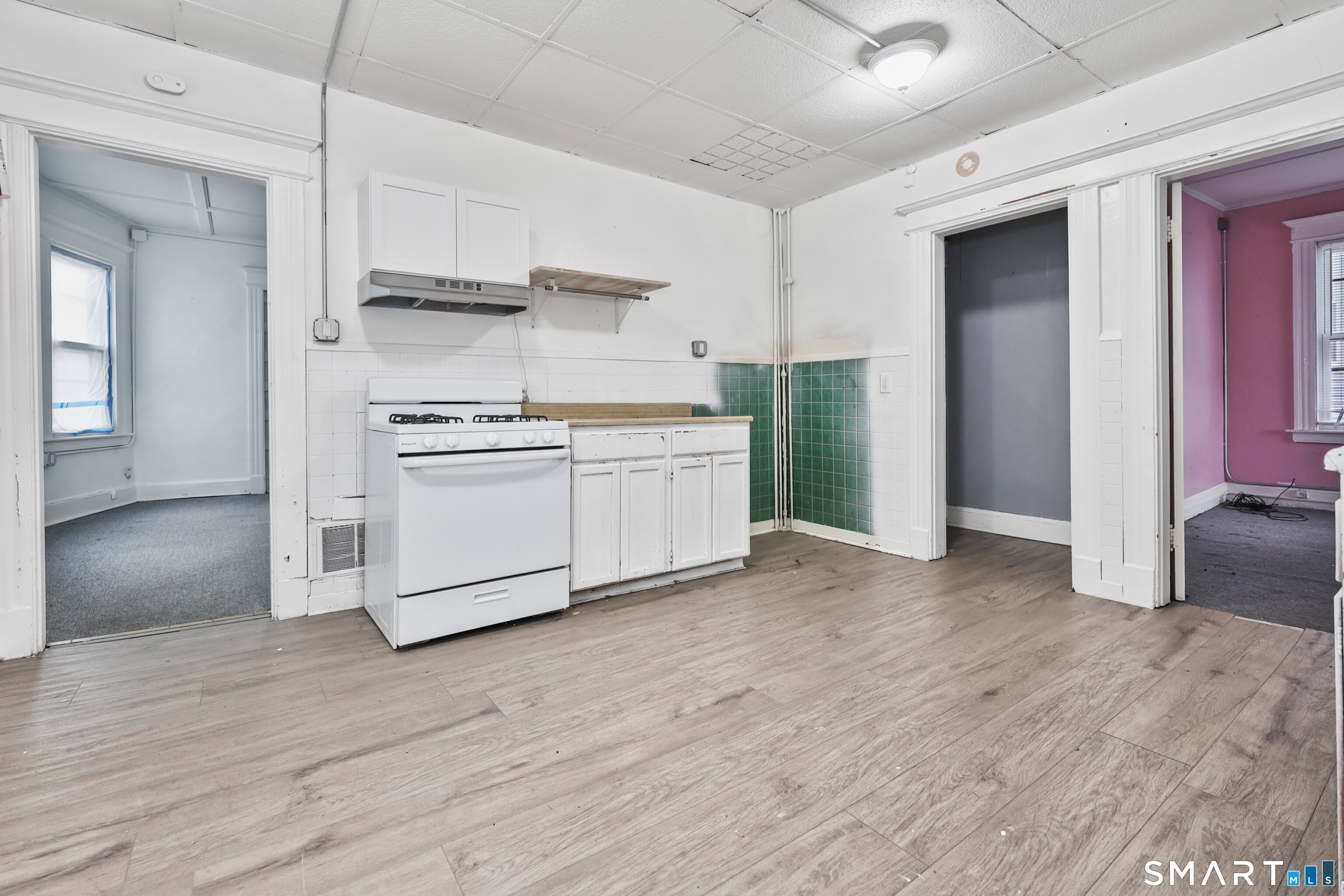82 Bunker Hill Avenue Waterbury, CT 06708 - Photo 14 of 37 a kitchen with stainless steel appliances granite countertop a sink and a refrigerator
