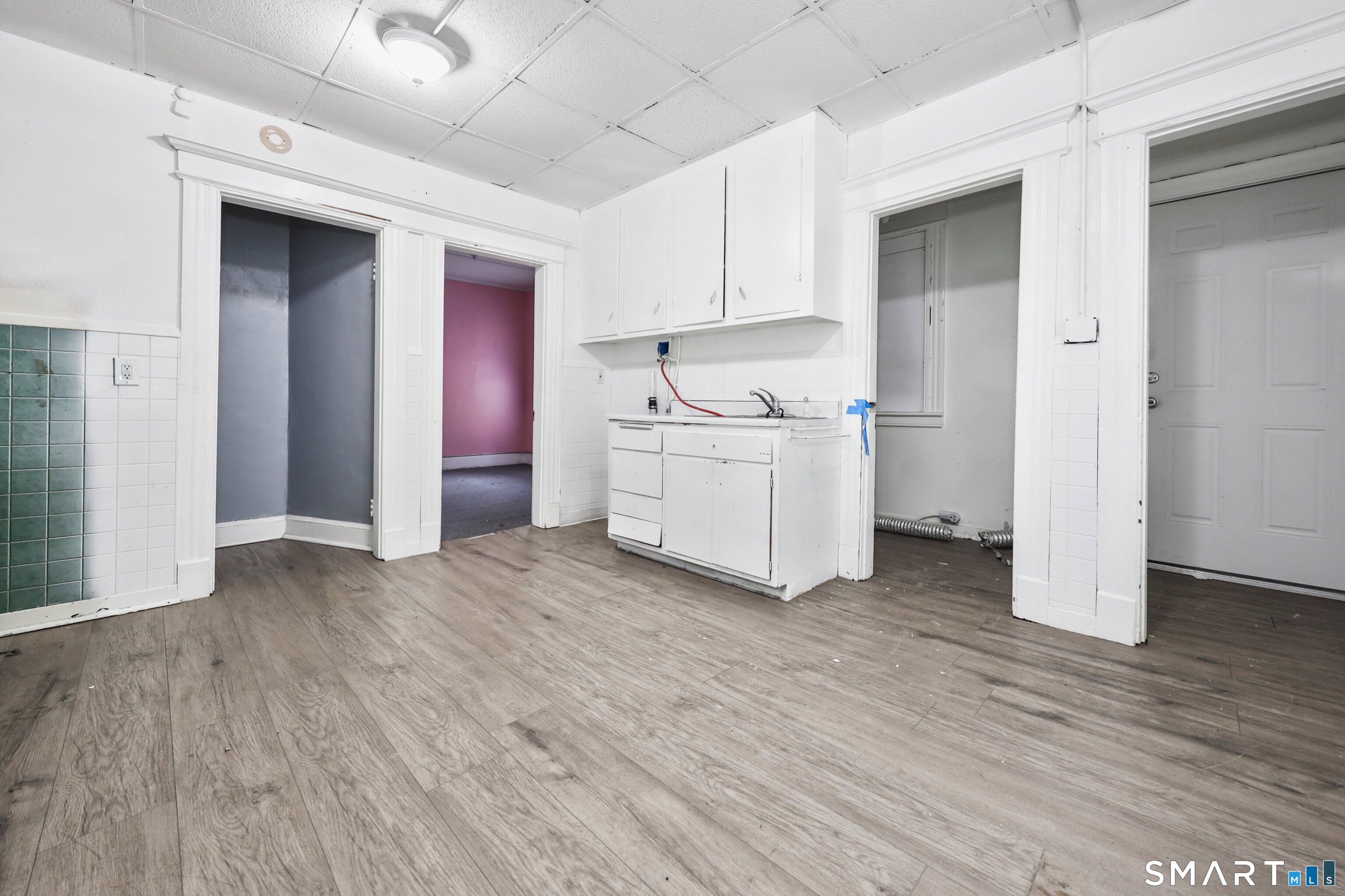 82 Bunker Hill Avenue Waterbury, CT 06708 - Photo 17 of 37 a kitchen with stainless steel appliances a stove top oven a sink and a refrigerator