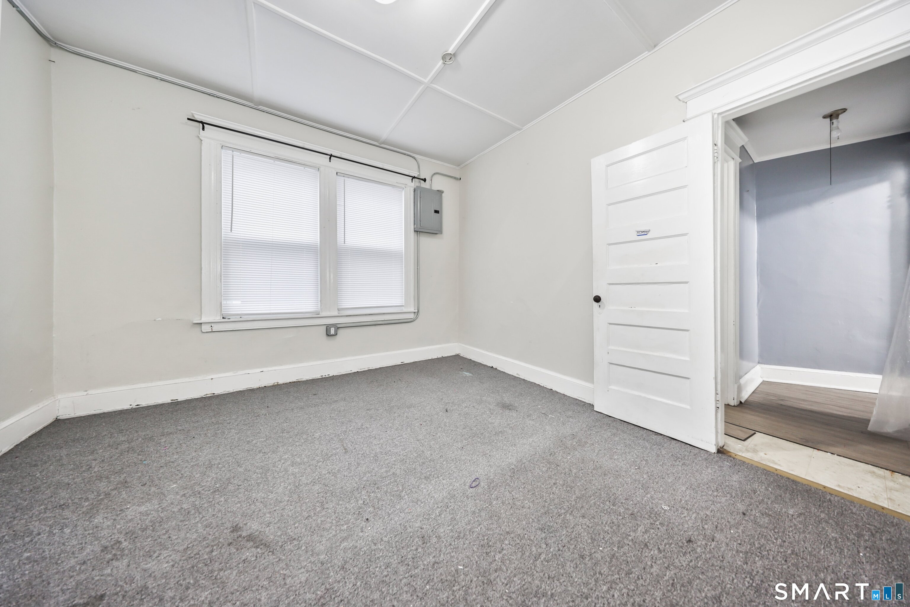 82 Bunker Hill Avenue Waterbury, CT 06708 - Photo 23 of 37 an empty room with a empty space and windows