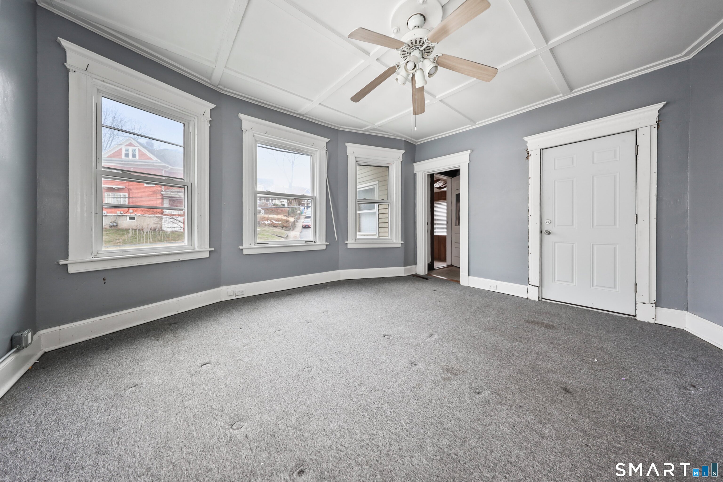 82 Bunker Hill Avenue Waterbury, CT 06708 - Photo 24 of 37 an empty room with windows and fan