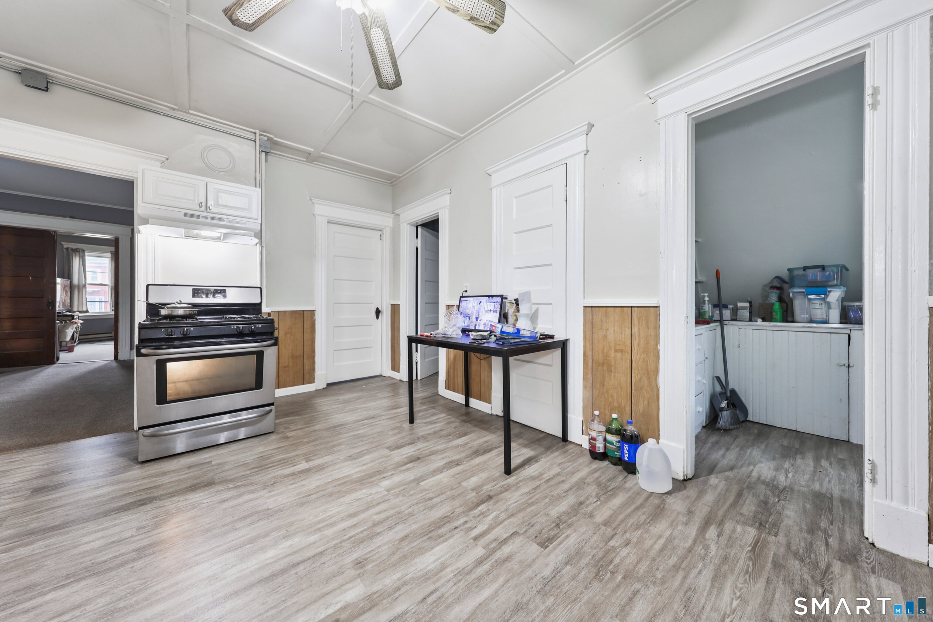 82 Bunker Hill Avenue Waterbury, CT 06708 - Photo 29 of 37 a view of a kitchen with furniture and wooden floor