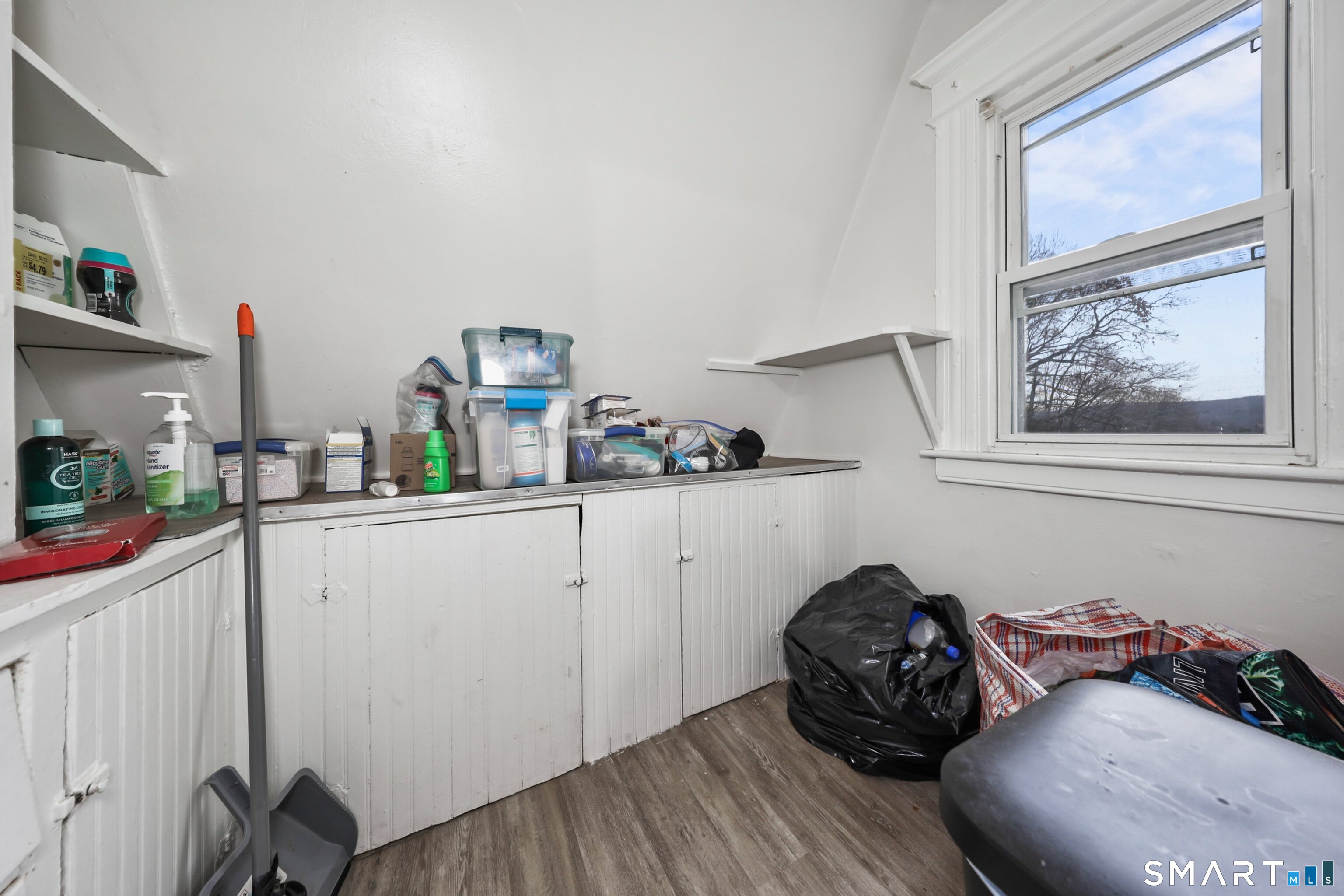 82 Bunker Hill Avenue Waterbury, CT 06708 - Photo 30 of 37 a bedroom with a bed and a window