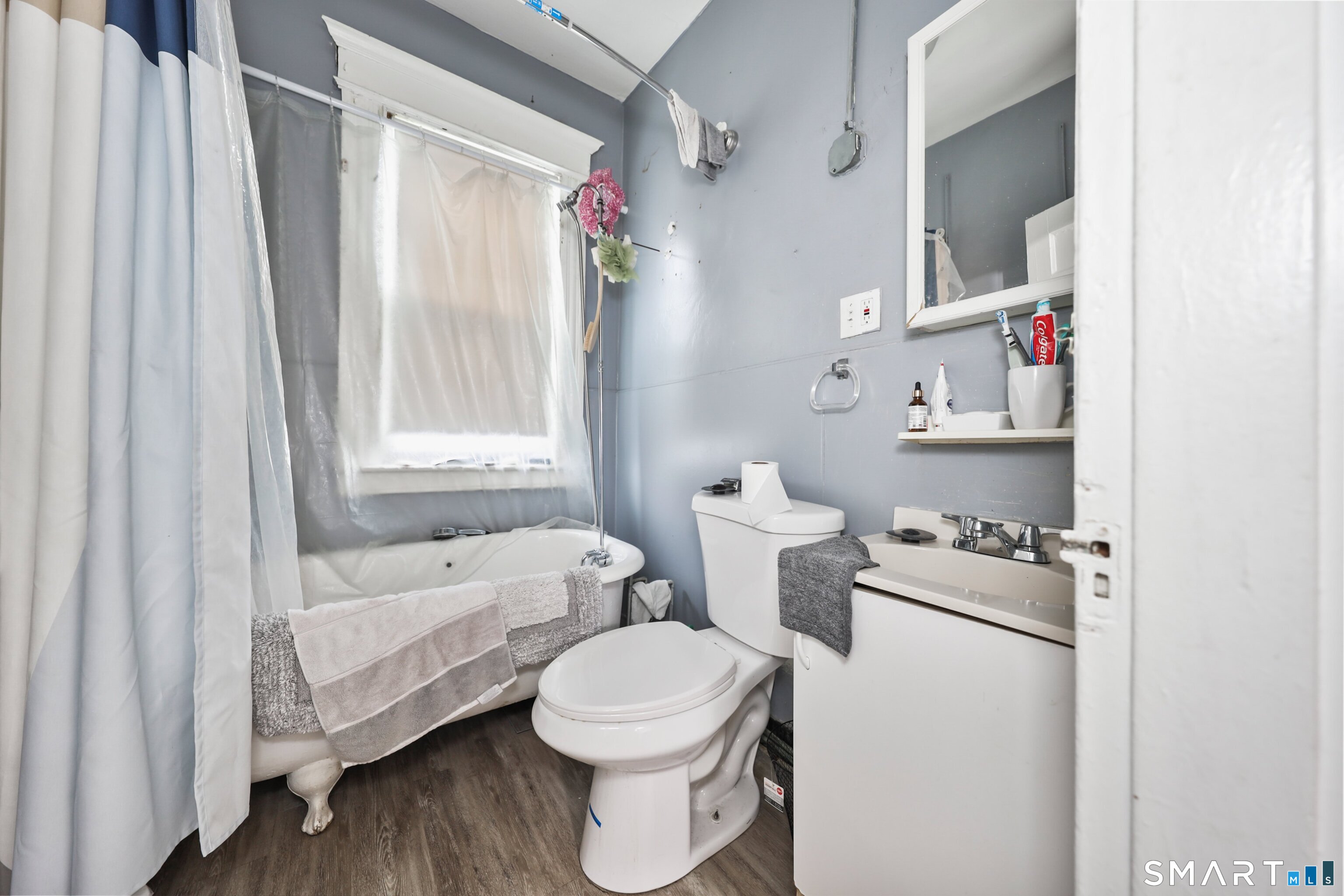 82 Bunker Hill Avenue Waterbury, CT 06708 - Photo 35 of 37 a bathroom with a sink toilet and shower