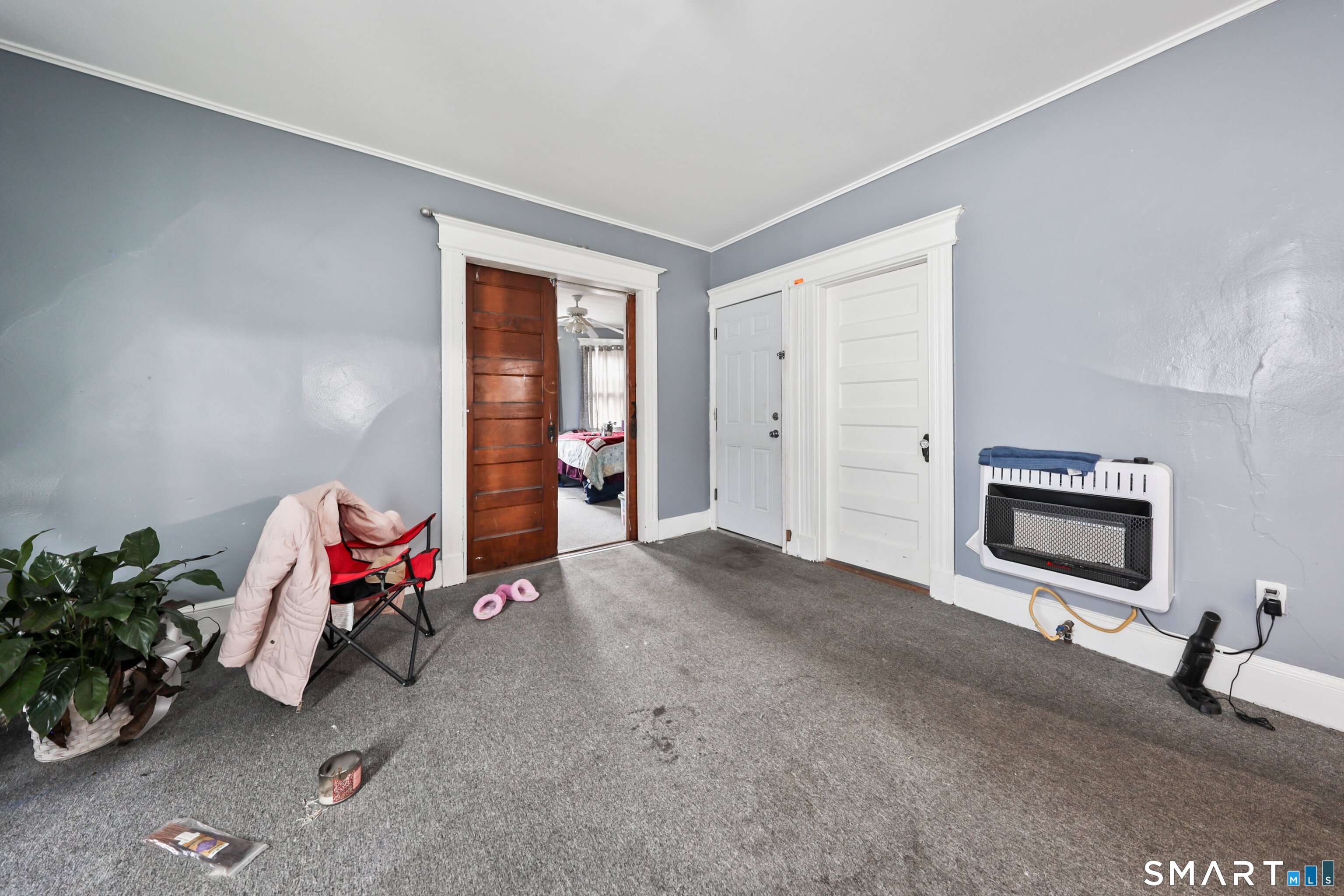 82 Bunker Hill Avenue Waterbury, CT 06708 - Photo 37 of 37 a living room with furniture gym equipment and a flat screen tv
