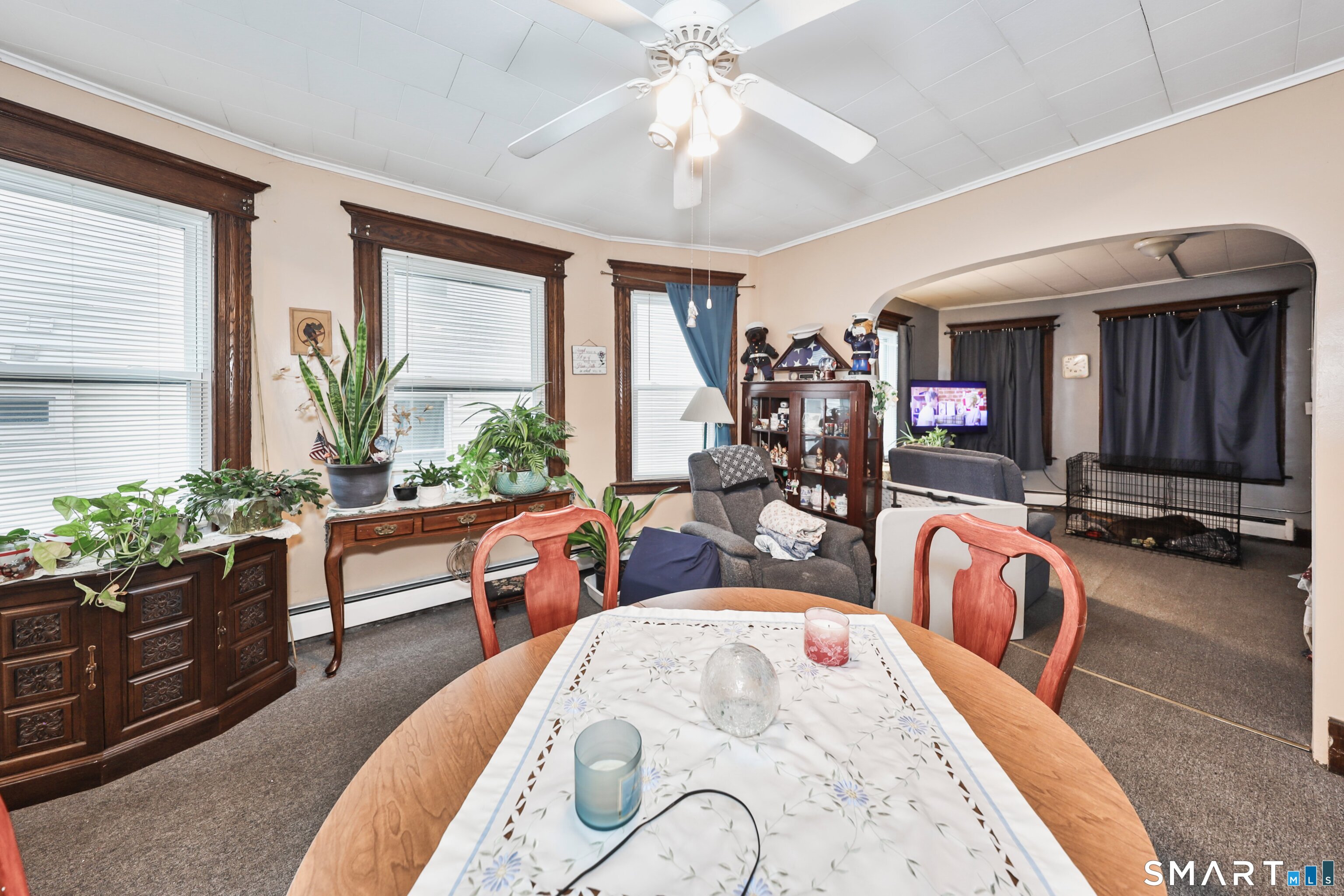 82 Bunker Hill Avenue Waterbury, CT 06708 - Photo 8 of 37 a living room with furniture fireplace and a large window