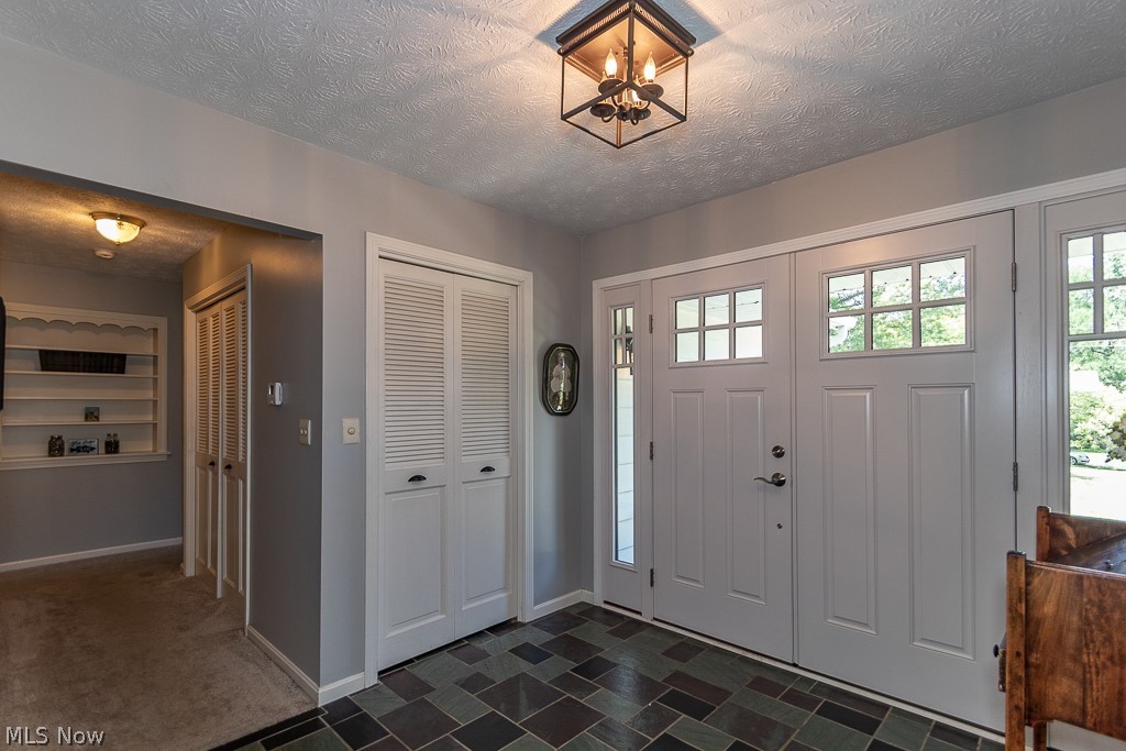 321 Barrington Ridge Road Painesville, OH 44077 - Photo 5 of 34 New Double-Entry Doors installed in 2017 open to a large front foyer.