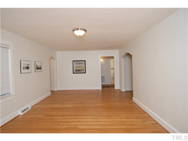 1919 Ruffin Street Durham, NC 27704 - Photo 12 of 25 View from opposite end of the LR. Left side arch leads to the front door. Nice entry with coat closet are unseen. Living Room