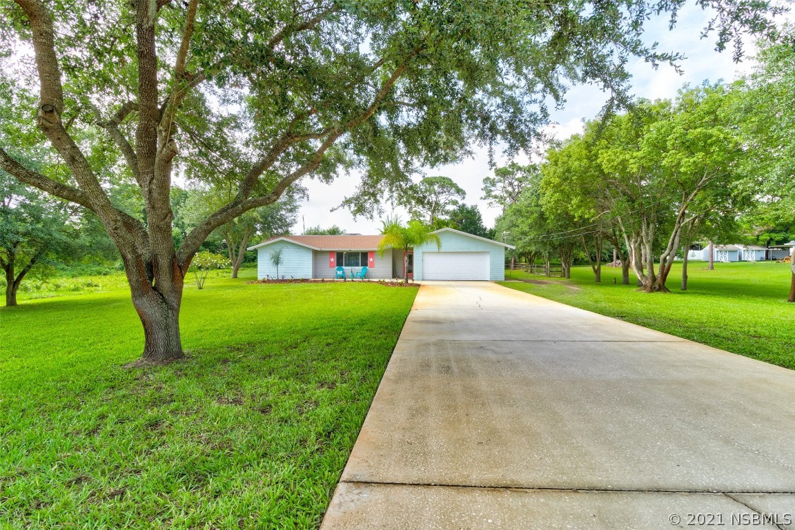 134 Arbor Lane Edgewater, FL 32141 - Photo 3 of 36 a front view of house with yard and green space
