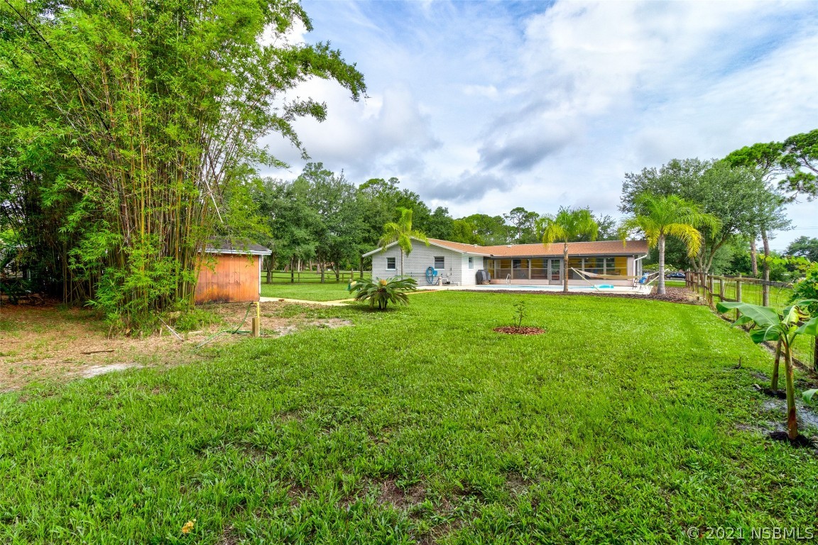 134 Arbor Lane Edgewater, FL 32141 - Photo 33 of 36 a house view with a garden space