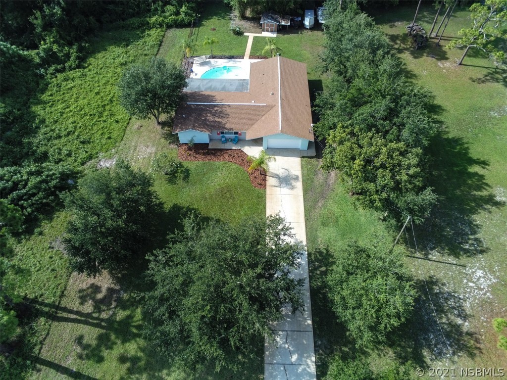 134 Arbor Lane Edgewater, FL 32141 - Photo 34 of 36 an aerial view of a house with a yard