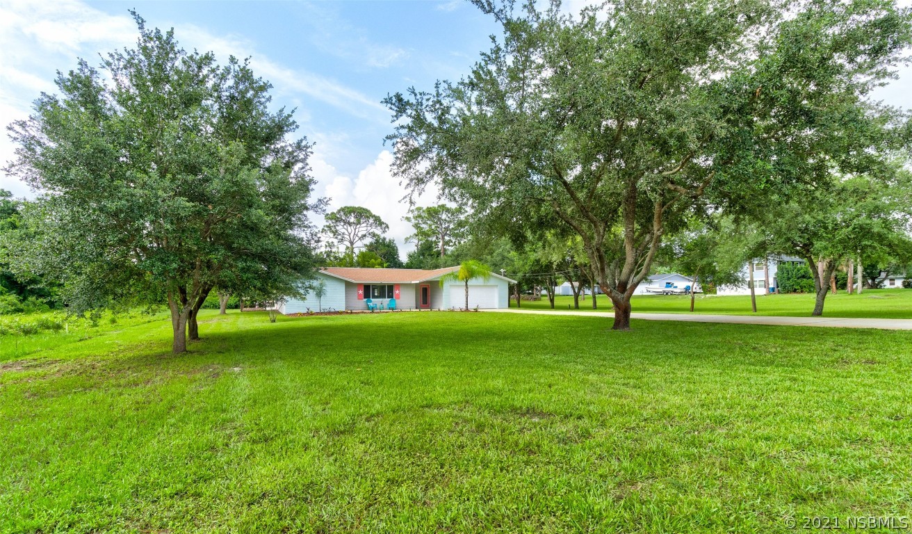 134 Arbor Lane Edgewater, FL 32141 - Photo 4 of 36 a garden view