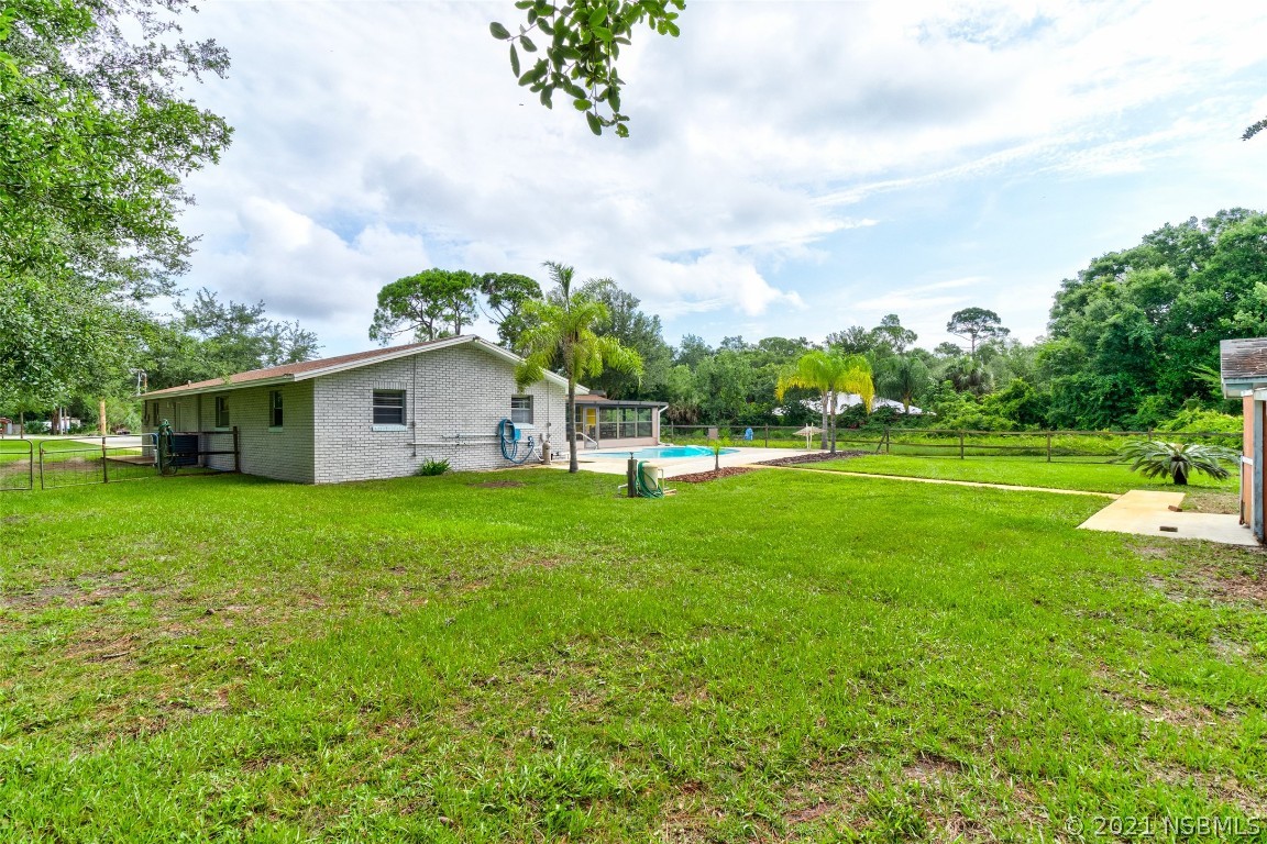 134 Arbor Lane Edgewater, FL 32141 - Photo 10 of 36 a view of a house with backyard and garden