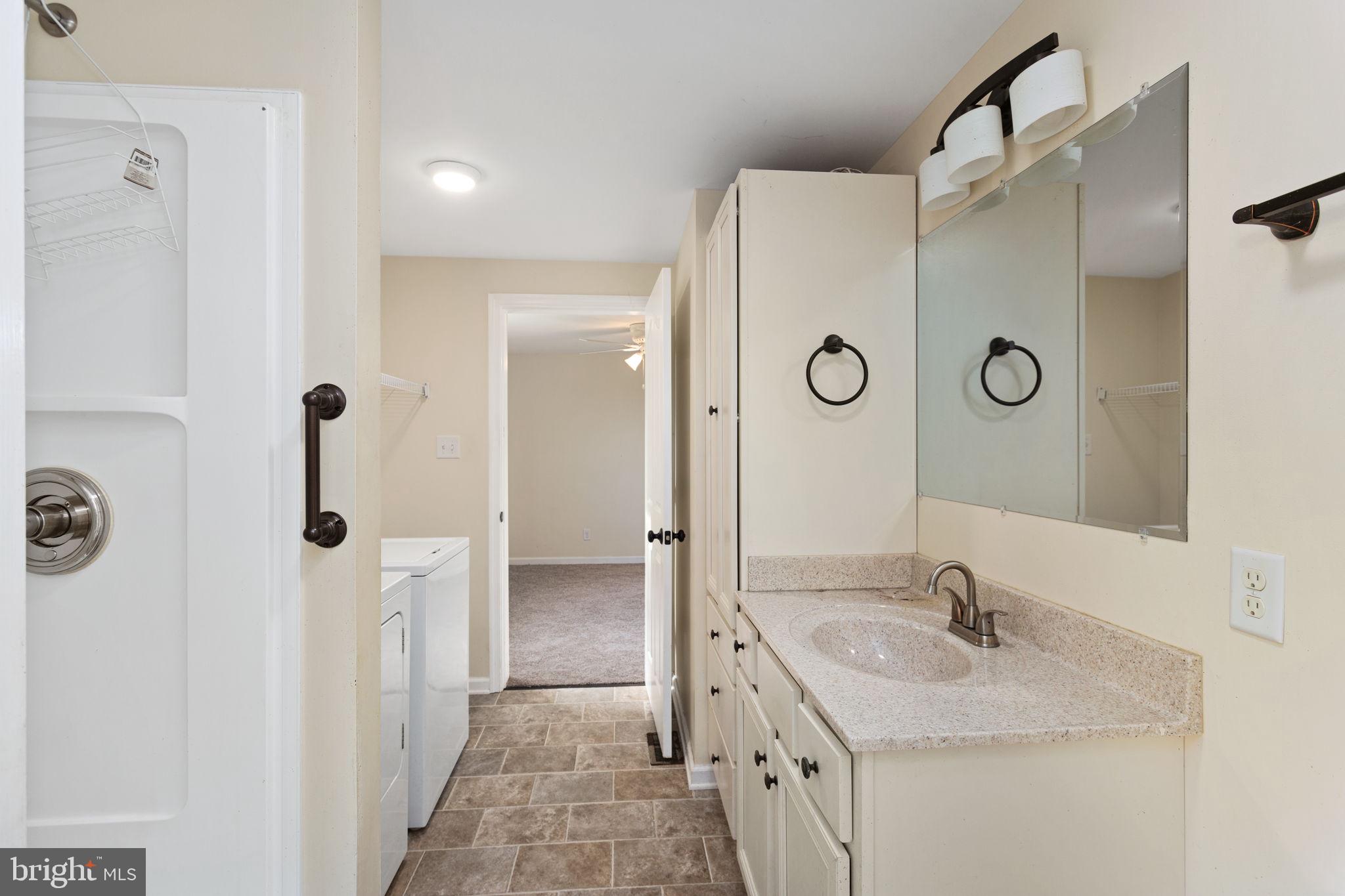 1919 Ridge Road New Market, VA 22844 - Photo 13 of 24 Primary Bath with laundry.