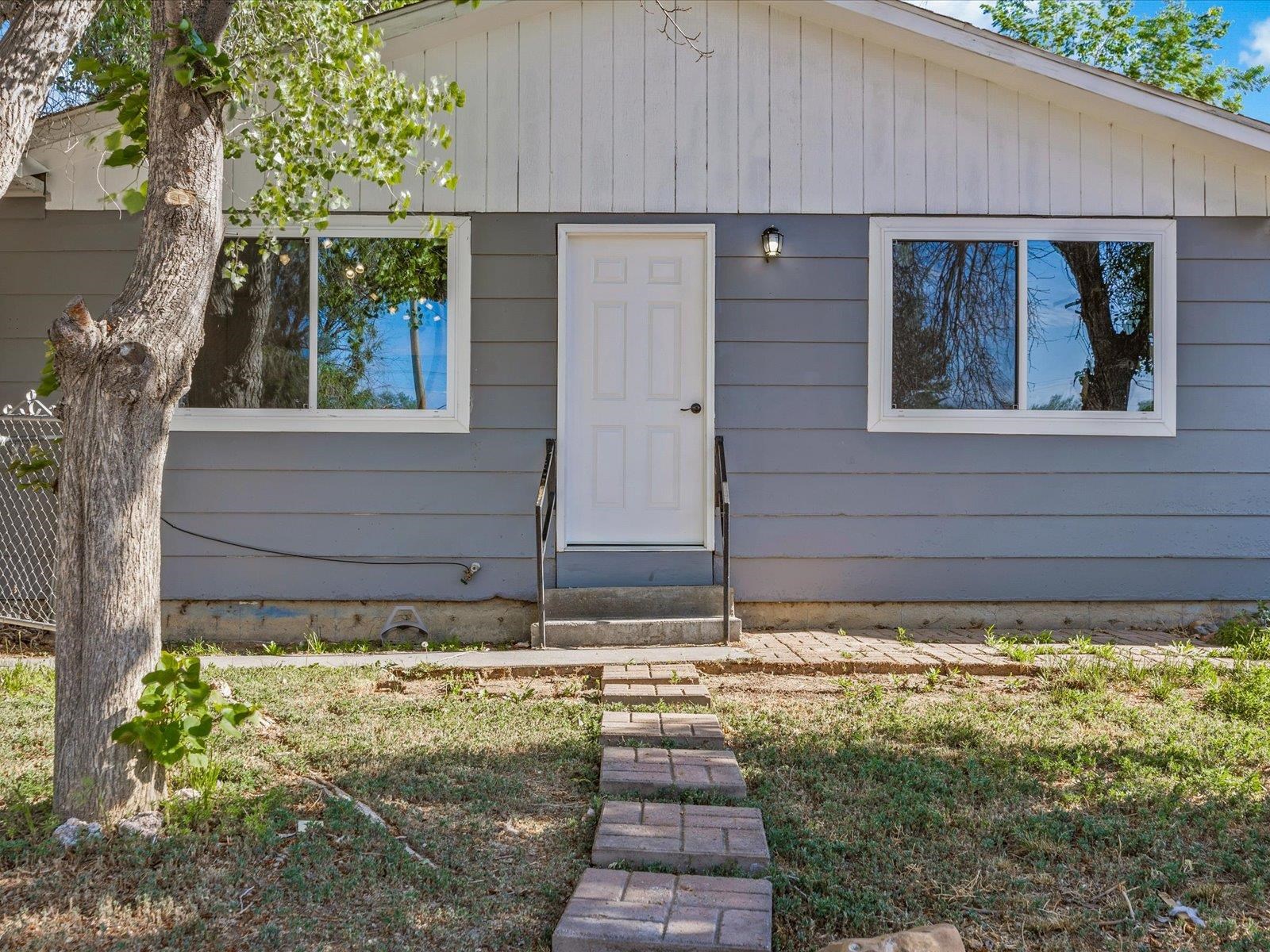 a view of house with backyard