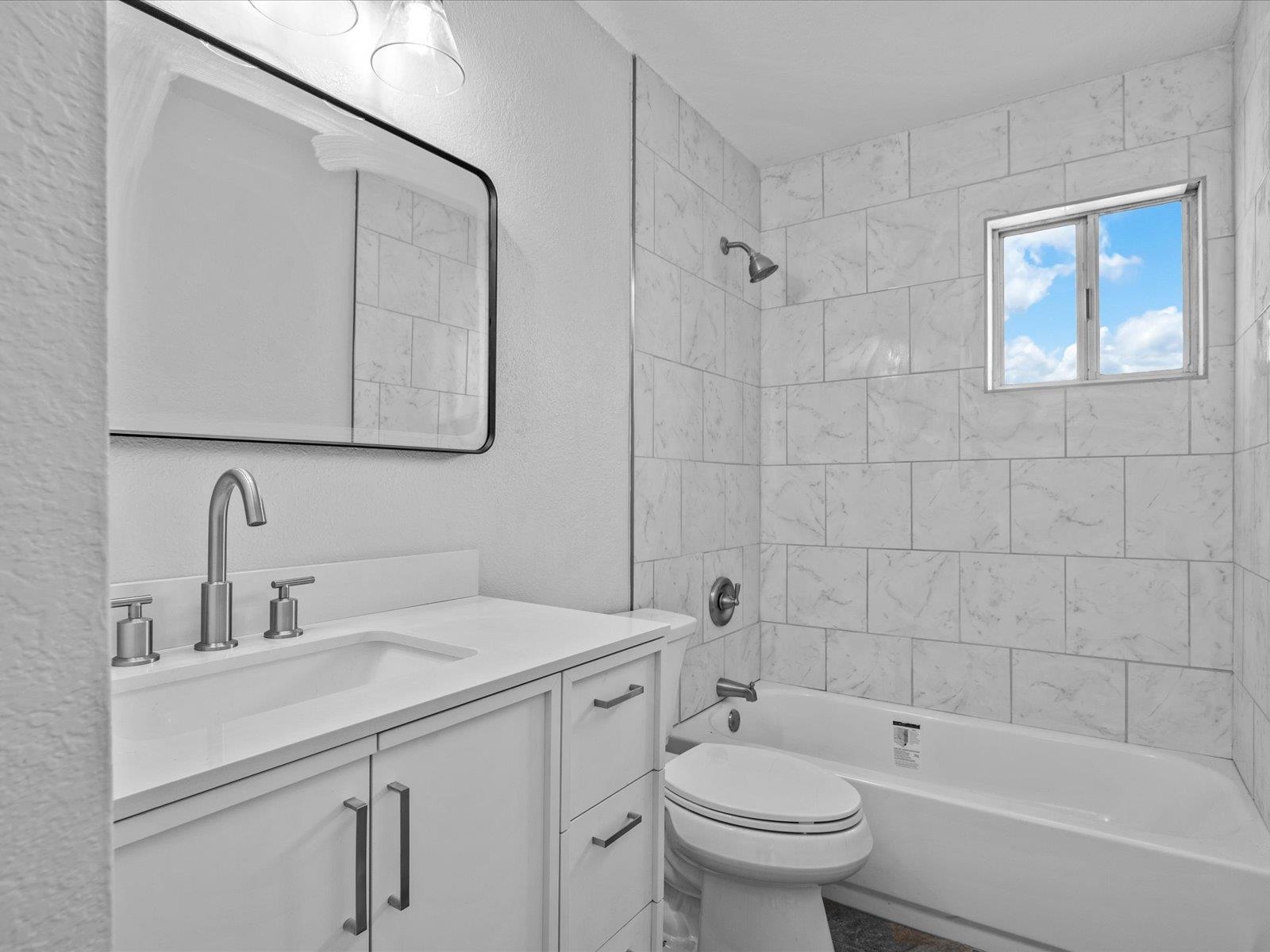 246 East Rangely Avenue Rangely, CO 81648 - Photo 12 of 21 a bathroom with a sink a toilet and shower