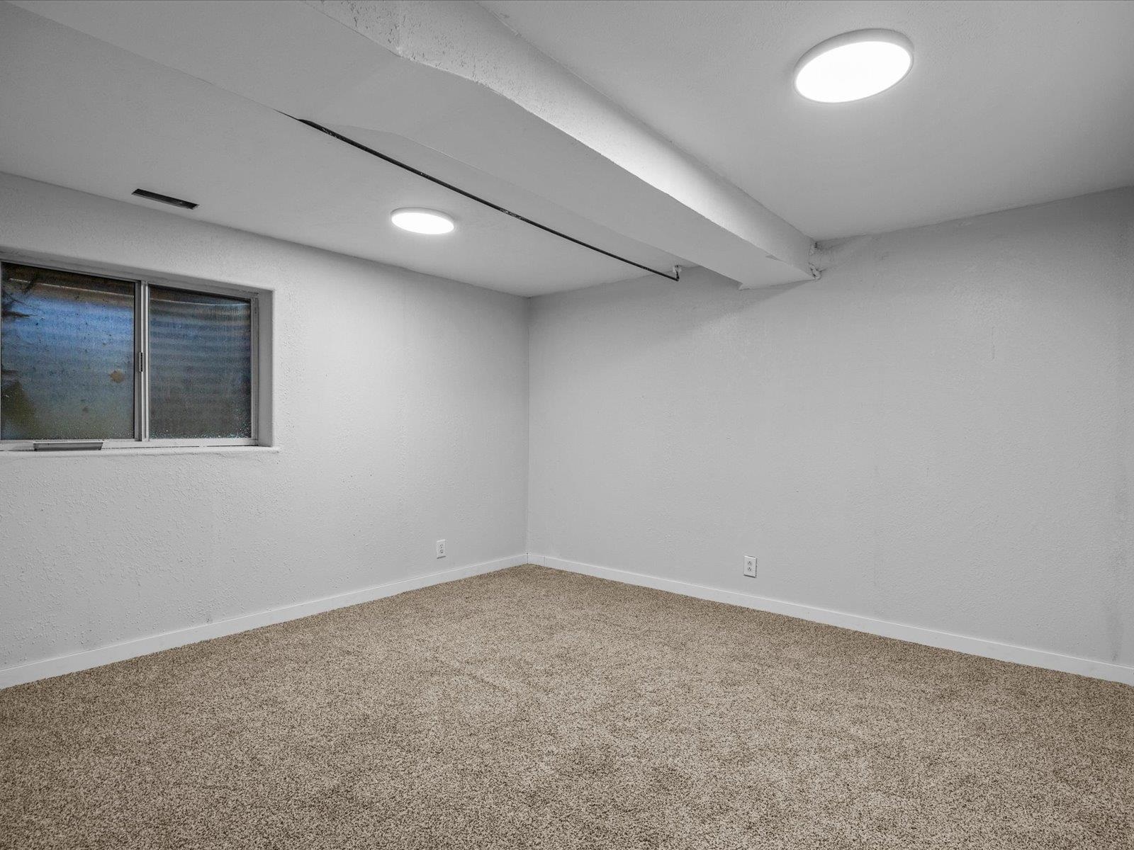 246 East Rangely Avenue Rangely, CO 81648 - Photo 16 of 21 an empty room with a empty space and windows