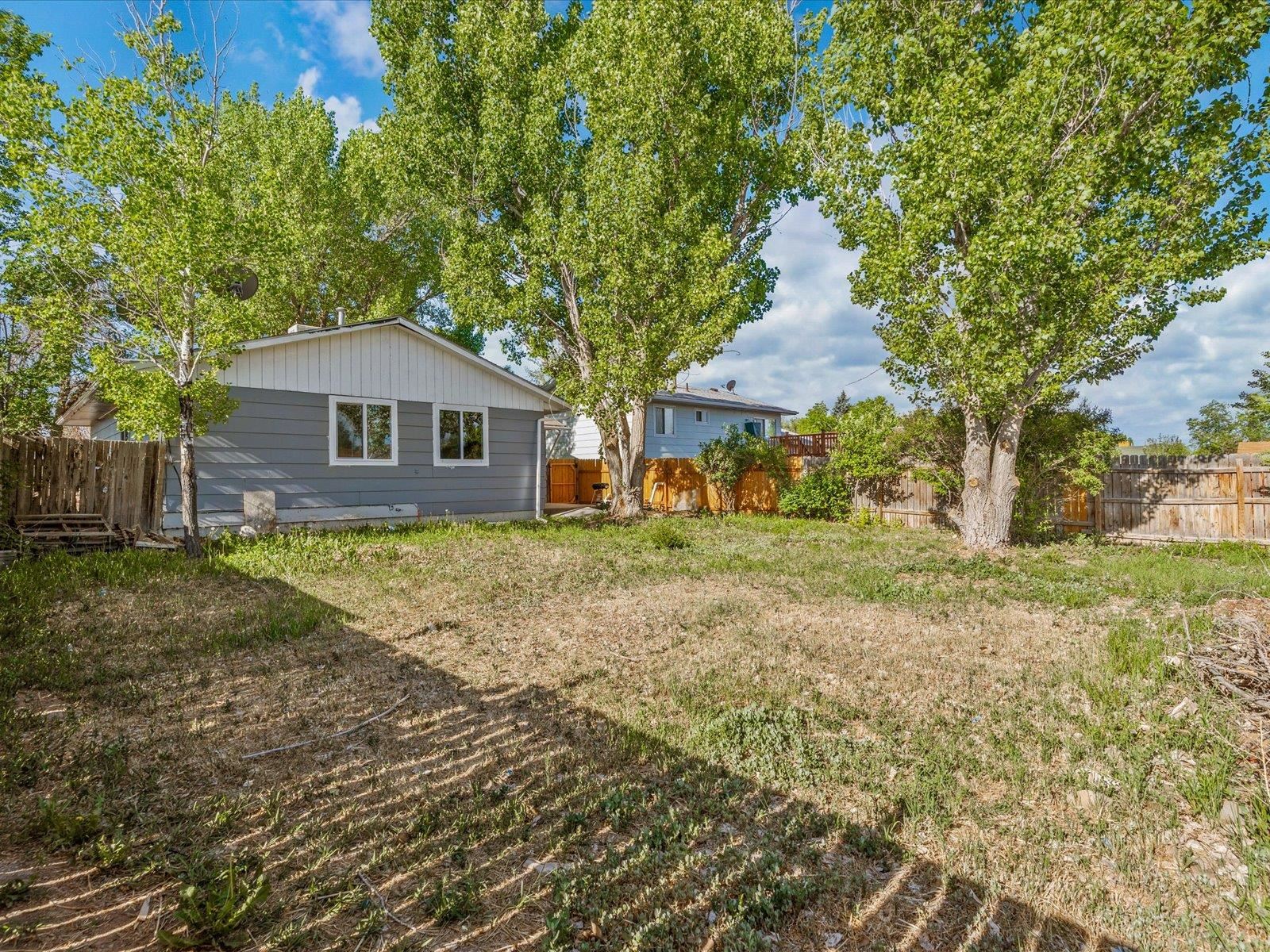 246 East Rangely Avenue Rangely, CO 81648 - Photo 20 of 21 a front view of a house with garden