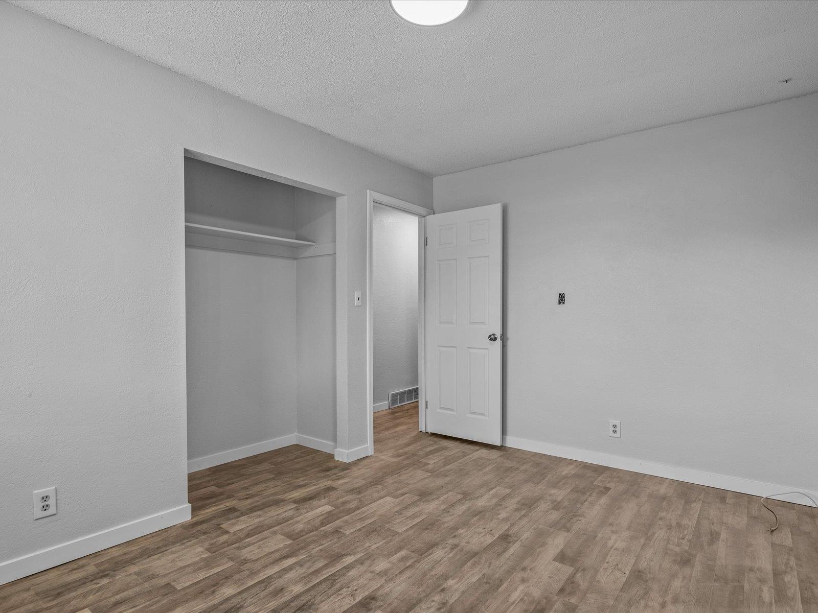 246 East Rangely Avenue Rangely, CO 81648 - Photo 8 of 21 a view of an empty room and wooden floor
