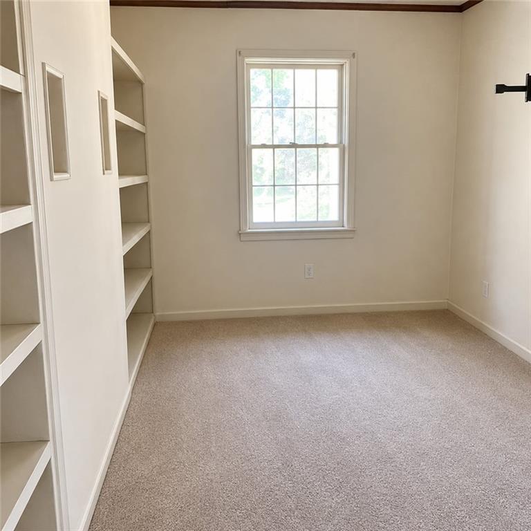 411 Stiles Road Selma, AL 36701 - Photo 4 of 7 an empty room with windows
