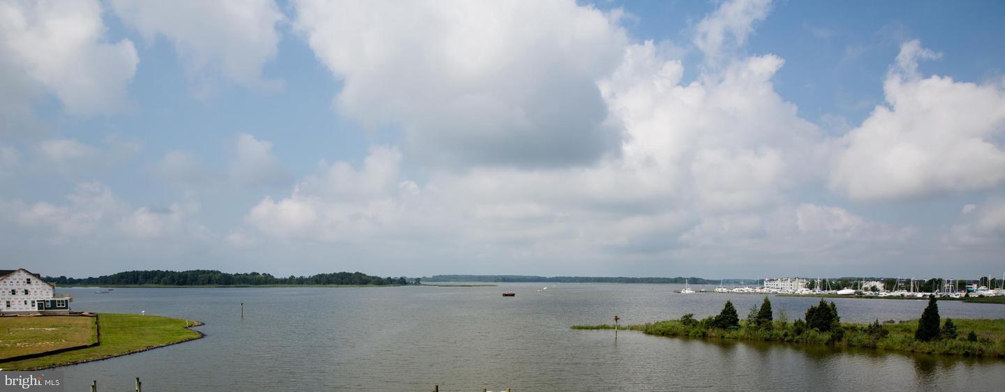 6370 Genoa Road Tracys Landing, MD 20779 - Photo 1 of 2 a view of a lake with houses in the back
