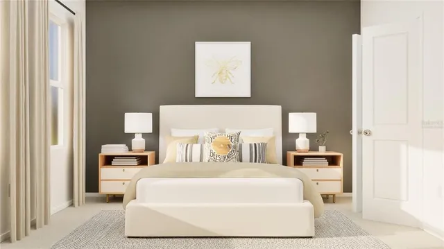 a large bed sitting in a bedroom next to a window