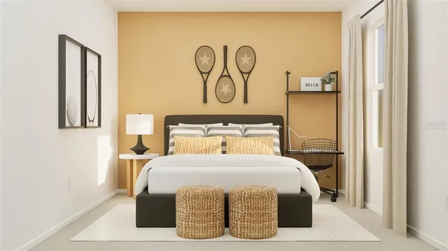 a bedroom with a bed and painting on the wall