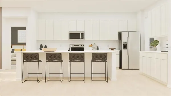 a kitchen with stainless steel appliances kitchen island granite countertop a refrigerator and cabinets