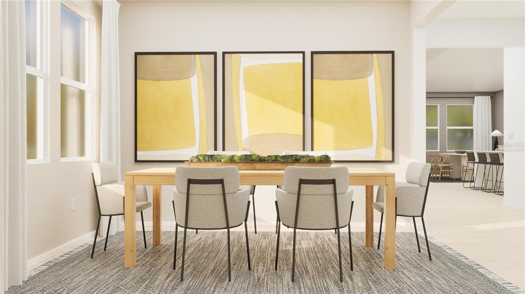 5629 Banyan Bay Road St. Cloud, FL 34771 - Photo 4 of 35 a view of a dining room with furniture and wooden floor