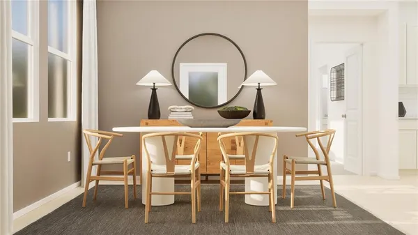 a dining room with furniture and a mirror