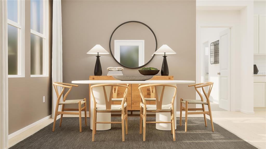 5629 Banyan Bay Road St. Cloud, FL 34771 - Photo 6 of 35 a dining room with furniture and a mirror