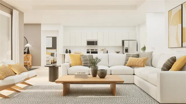 a living room with furniture white walls and a large window