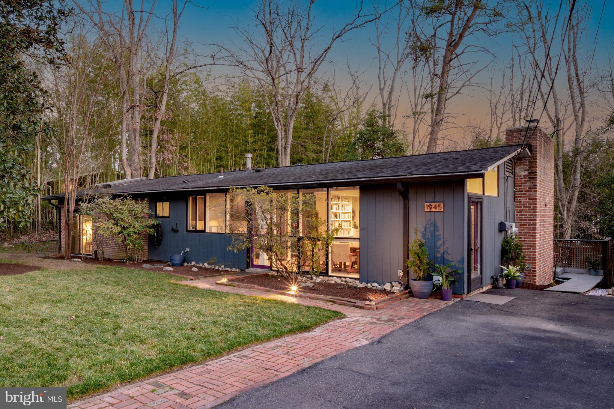 1945 Marthas Road Alexandria, VA 22307 - Photo 1 of 52 a front view of a house with a yard