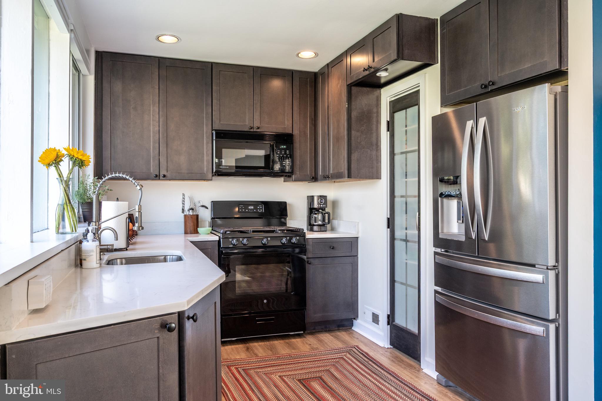 1945 Marthas Road Alexandria, VA 22307 - Photo 19 of 52 a kitchen with stainless steel appliances a refrigerator sink and microwave