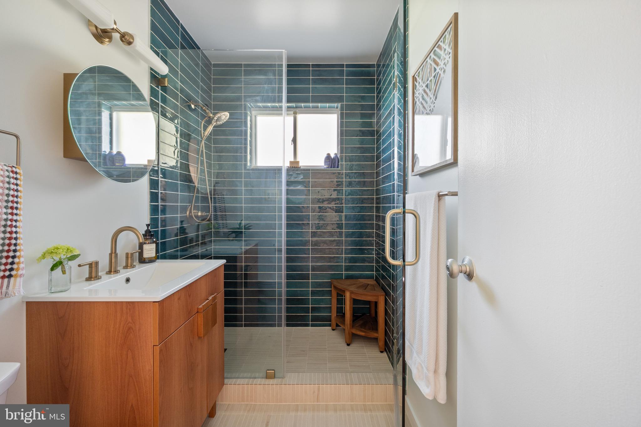 1945 Marthas Road Alexandria, VA 22307 - Photo 30 of 52 a bathroom with a sink a toilet and a mirror