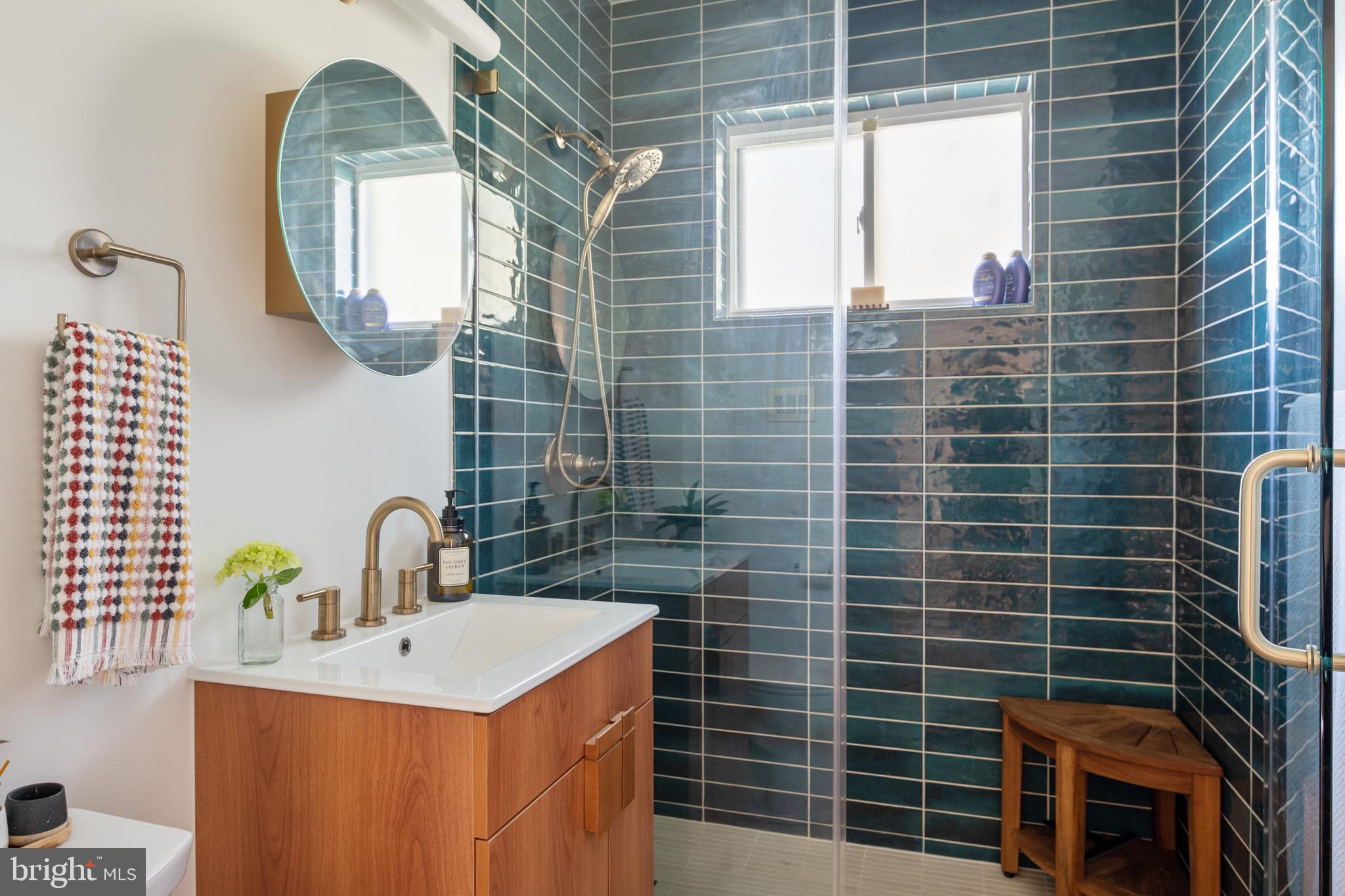 1945 Marthas Road Alexandria, VA 22307 - Photo 31 of 52 a bathroom with a sink a window and a mirror