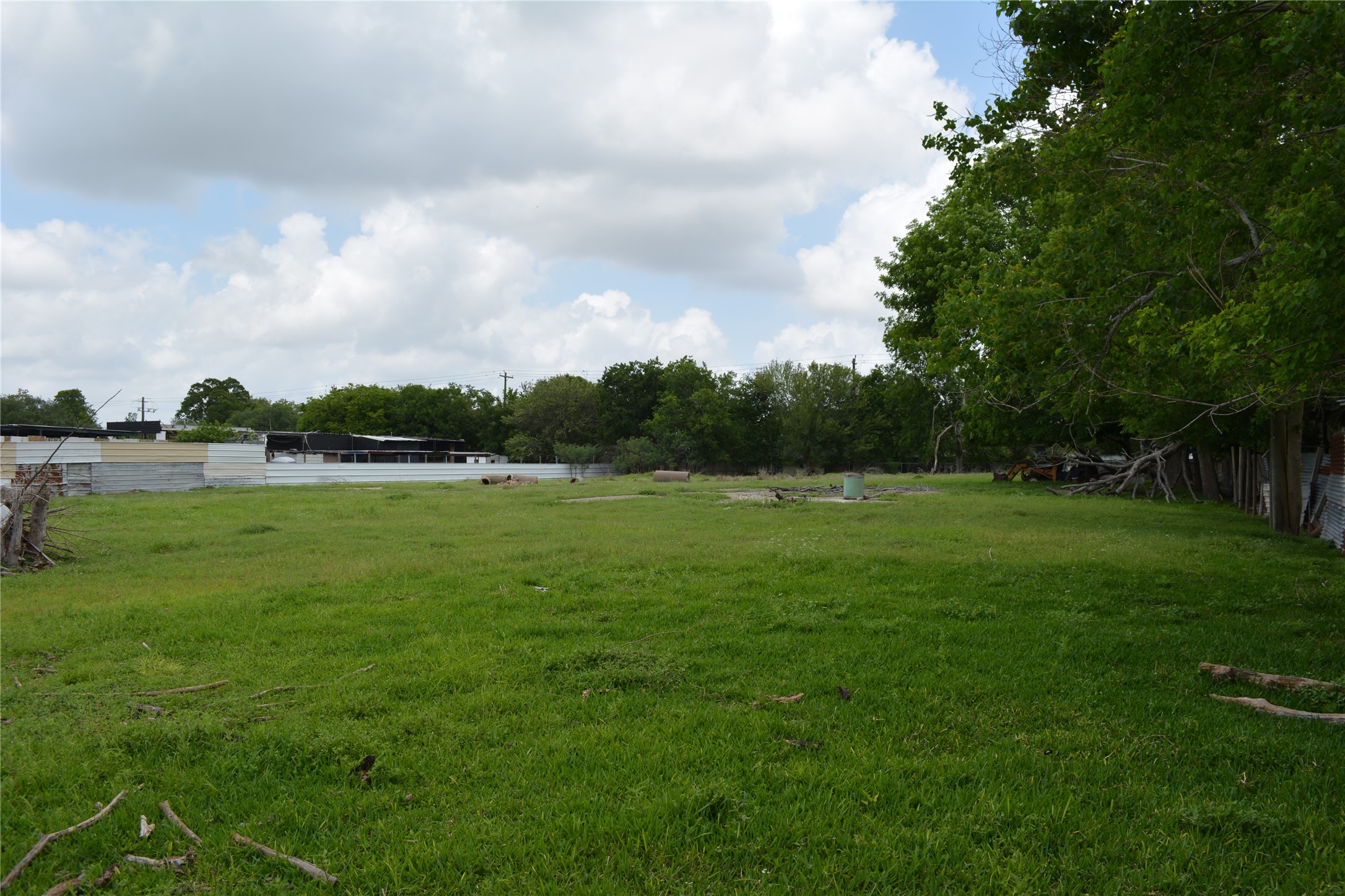 0 Reed Road Houston, TX 77033 - Photo 12 of 24 a view of a green field with wooden fence