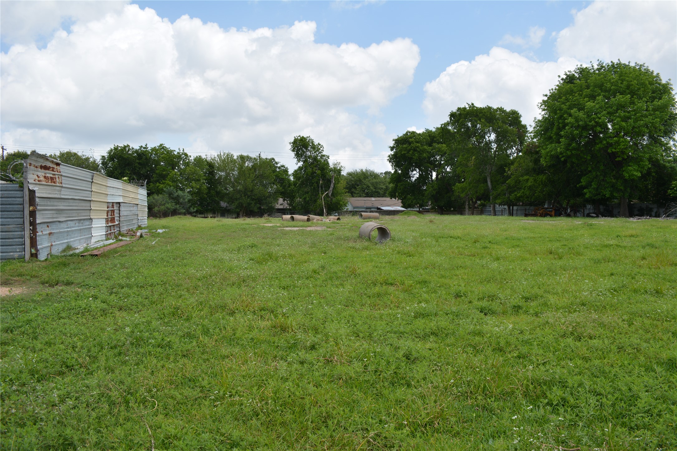 0 Reed Road Houston, TX 77033 - Photo 8 of 24 a view of a green field with wooden fence
