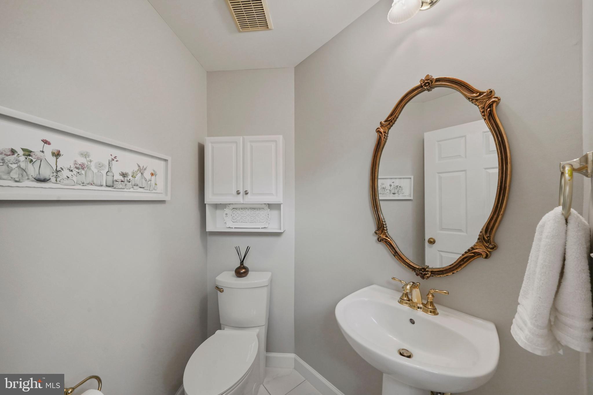 6660 Debra Lu Way Springfield, VA 22150 - Photo 19 of 37 Updated main level powder room with custom tile