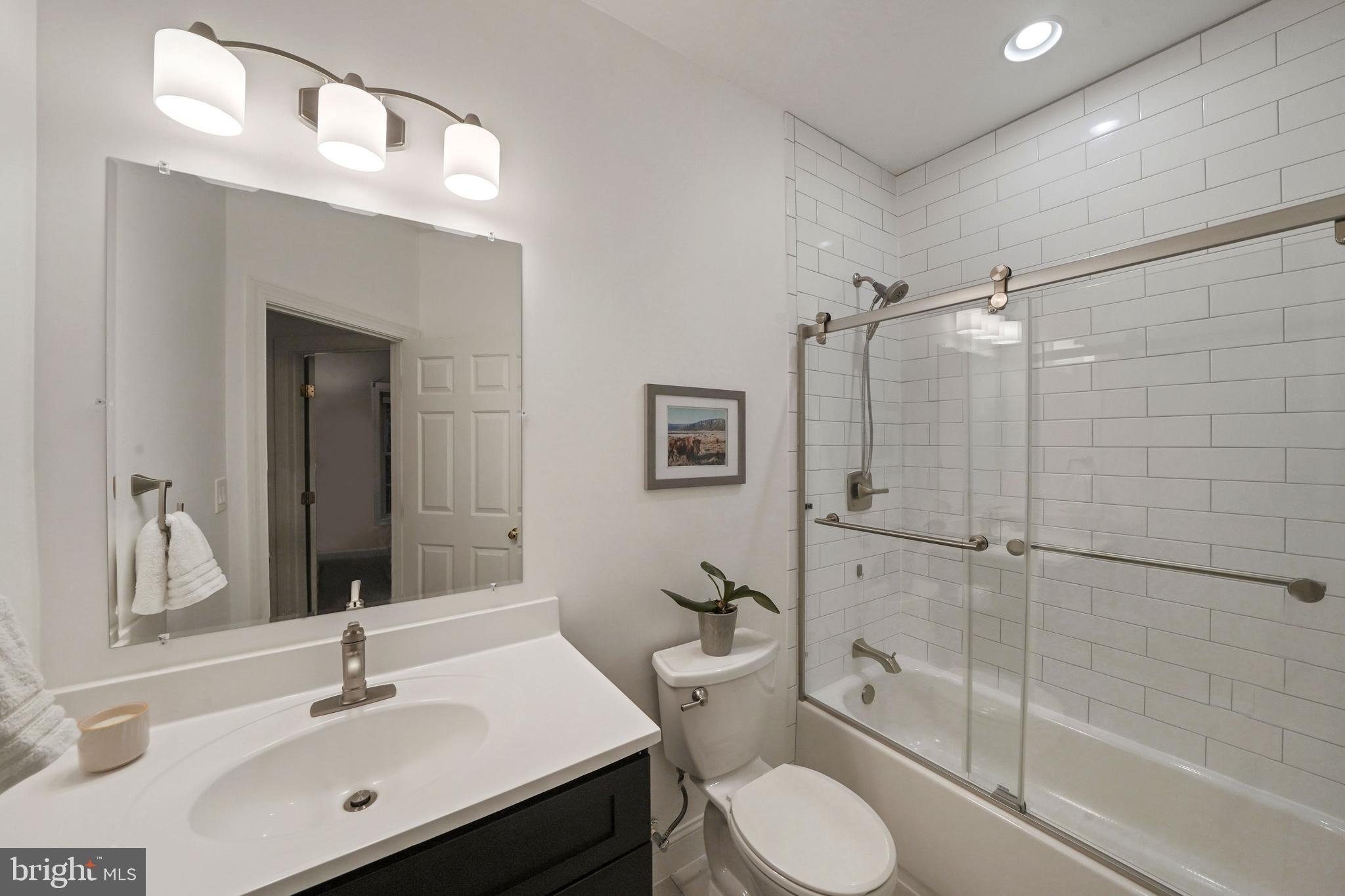 6660 Debra Lu Way Springfield, VA 22150 - Photo 27 of 37 Updated hall bath with new vanity and custom tile