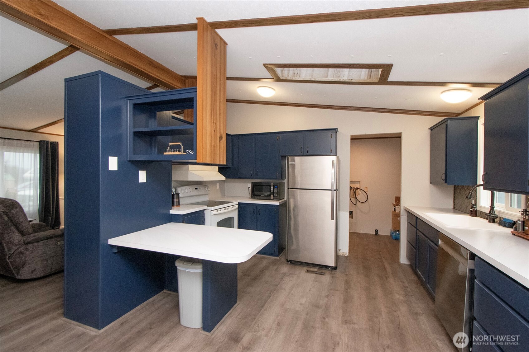 491 Mill Road, Unit 30 Sequim, WA 98382 - Photo 11 of 39 a kitchen with stainless steel appliances a refrigerator and a sink