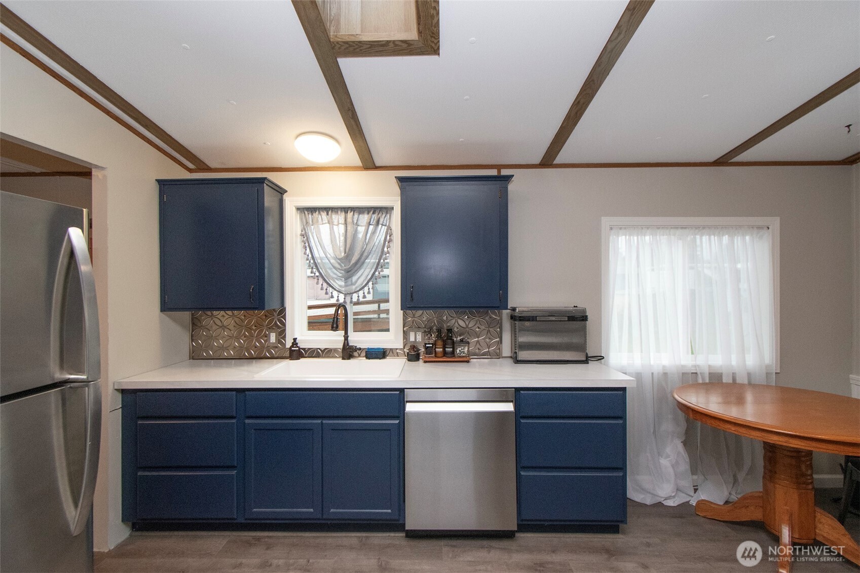 491 Mill Road, Unit 30 Sequim, WA 98382 - Photo 15 of 39 a bathroom with a double vanity sink a mirror and a bathtub