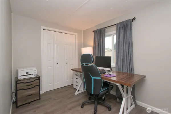 a workspace with furniture and a window