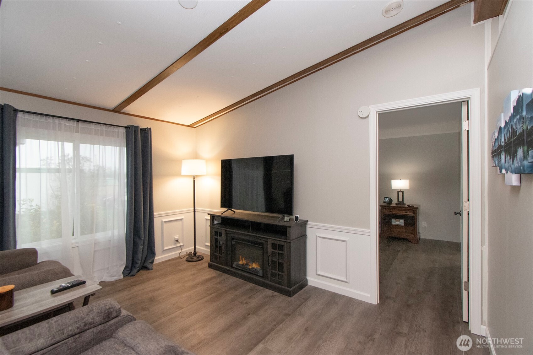 491 Mill Road, Unit 30 Sequim, WA 98382 - Photo 24 of 39 a living room with furniture and a flat screen tv