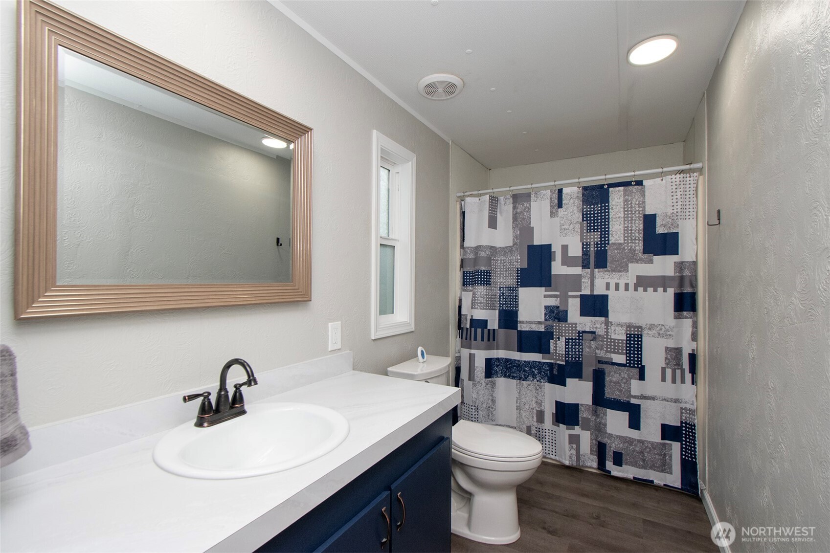 491 Mill Road, Unit 30 Sequim, WA 98382 - Photo 28 of 39 a bathroom with a sink a toilet and shower