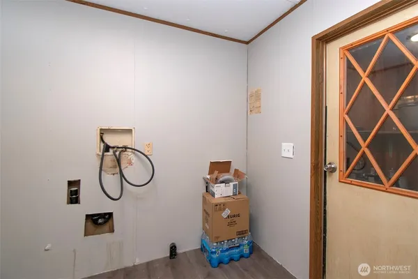 a view of light fixtures and wooden door