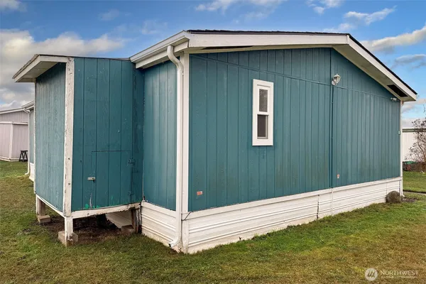 a view of a balcony with furniture
