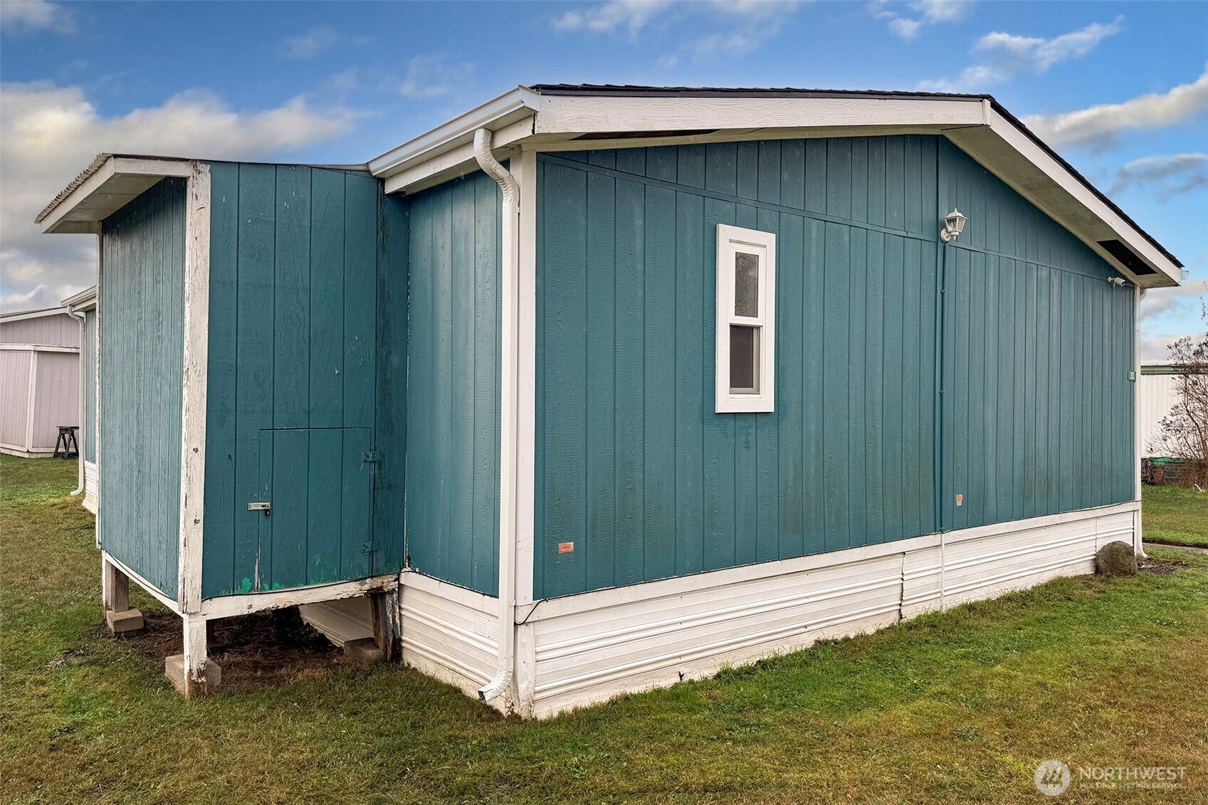 491 Mill Road, Unit 30 Sequim, WA 98382 - Photo 34 of 39 a front view of a house with a yard